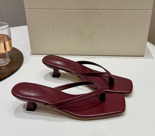 Burgundy kitten heel sandals.
